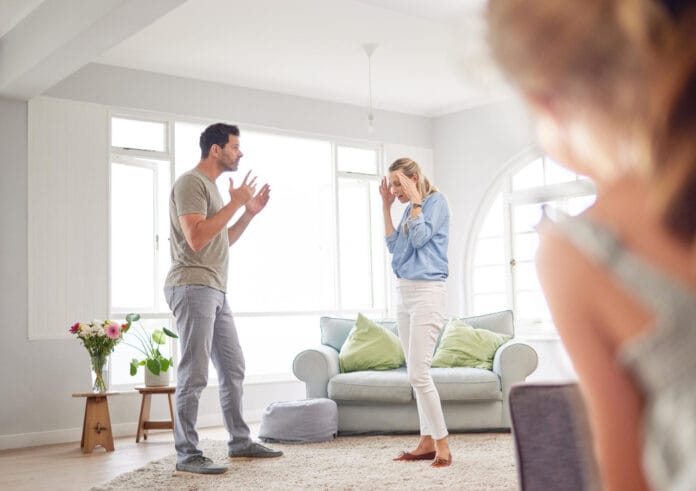 couple-divorce-fight-child-trauma-with-mental-health-anxiety-depression-from-watching-parents-stress-argument-burnout-man-woman-mother-father-with-girl-house-living-room