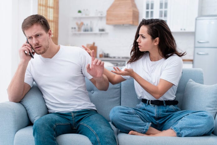 woman-being-angry-while-her-boyfriend-is-talking-phone